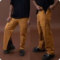 man wearing mustard yellow cargo trousers with inner leg  and outer seam zips